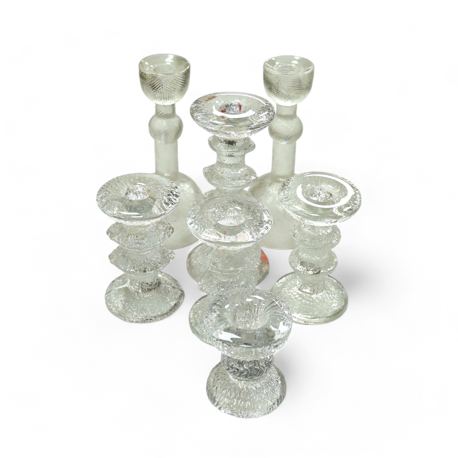 A group of Scandinavian clear glass candlesticks (7) including Timo Sarpaneva, tallest Arabia, 19.5cm high. Condition - good